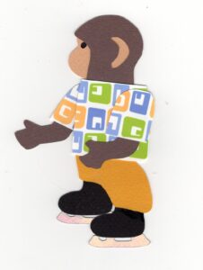Cut paper illustration of an anthropomorphic monkey wearing ice skates
